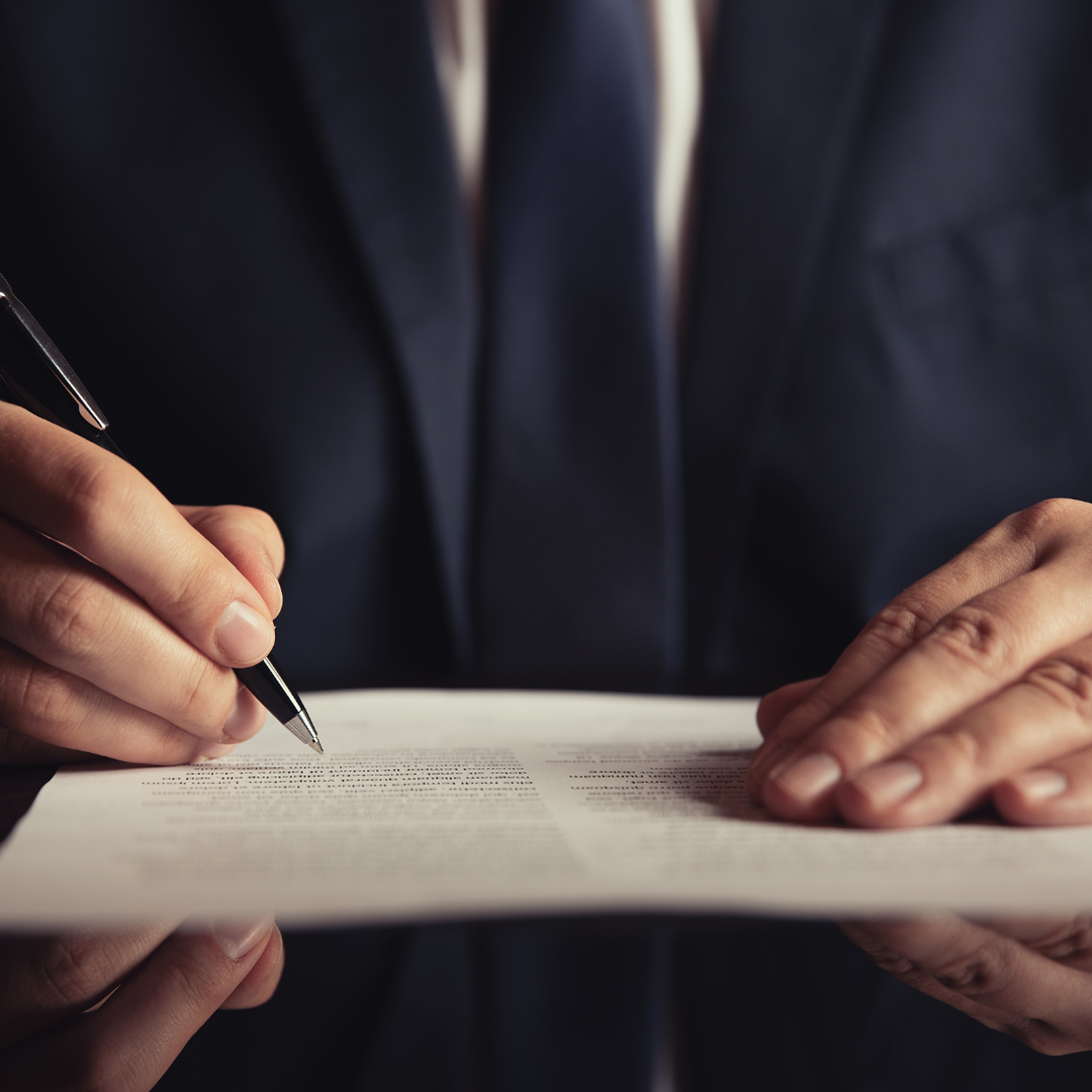 Attorney signing a legal document